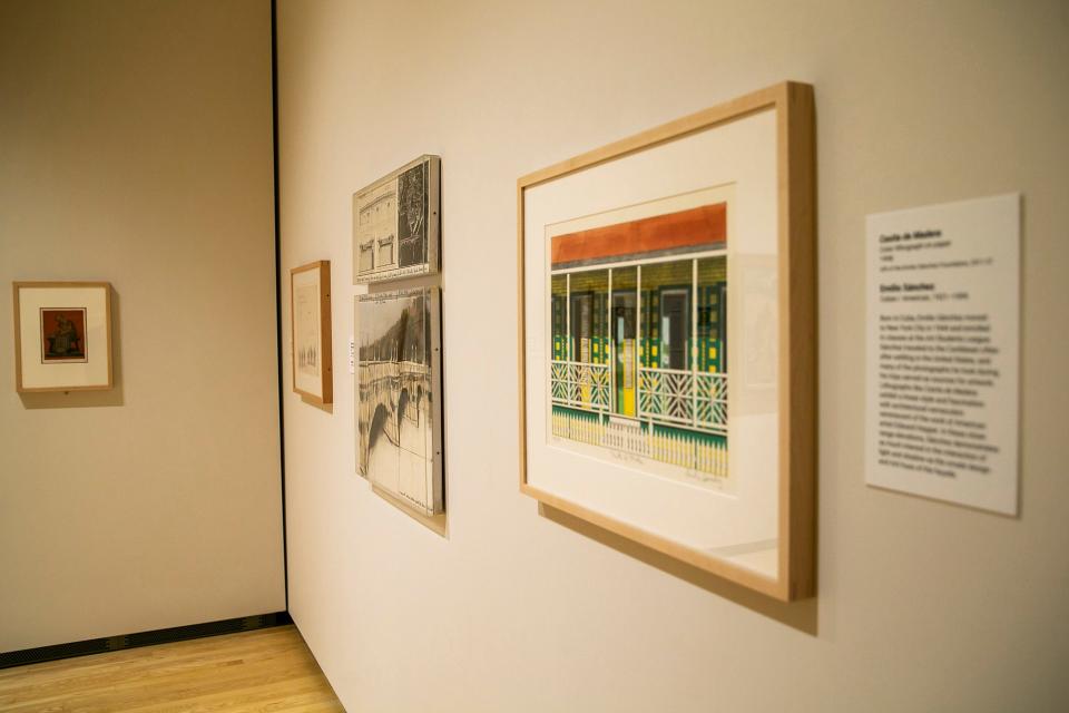 "Casita de Madera" by Emilio Sánchez, right, is seen at the Stanley Museum of Art alongside "The Pont Neuf Wrapped (Project for Paris)" by Christo.