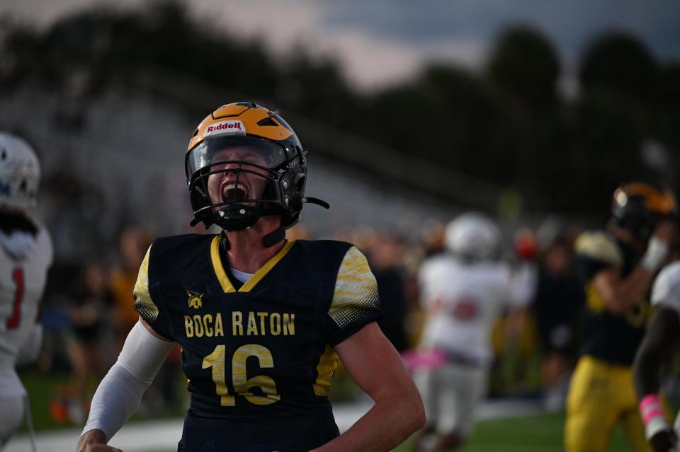 Boca Raton quarterback Chance Routson celebrates a touchdown against Cardinal Gibbons on Friday, Oct. 20, 2023 in Boca Raton.