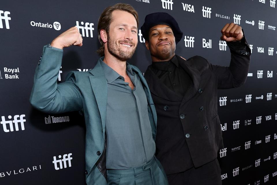 Glen Powell and Jonathan Majors attend the "Devotion" Premiere at Cinesphere on September 12, 2022 in Toronto, Ontario.