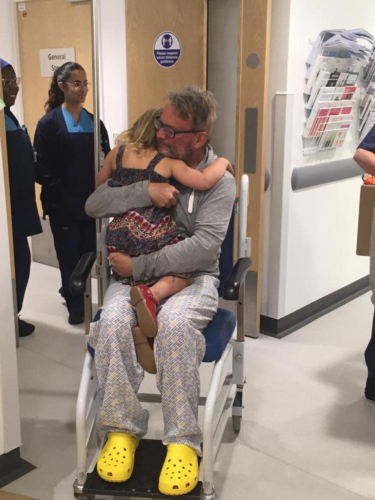 Andy pictured with his daughter Isabelle on his last day of radiotherapy treatment. (Brain Tumour Research/SWNS)