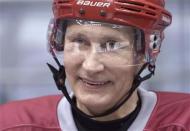 Russia's President Vladimir Putin smiles as he takes part in a friendly ice hockey match in the Bolshoi Ice Palace near Sochi January 4, 2014. REUTERS/Alexei Nikolskiy/RIA Novosti/Kremlin