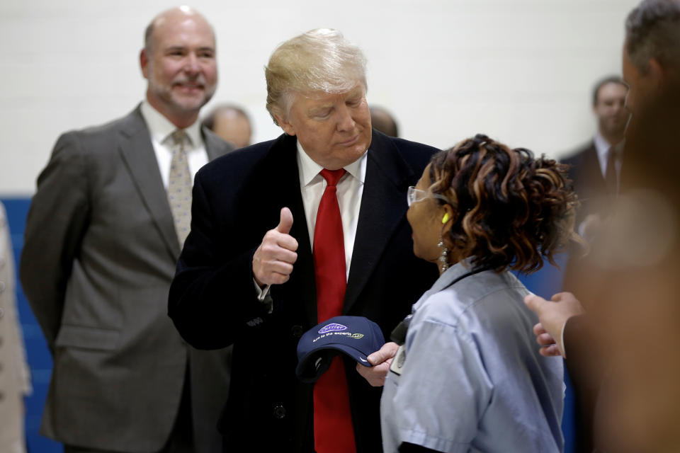 U.S. President-elect Donald Trump stands with Carrier worker Sadieka Alexander while touring a carrier factory in Indianapolis, Indiana, U.S., December 1, 2016.  REUTERS/Mike Segar