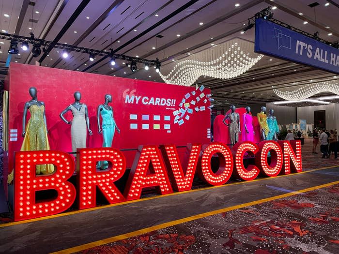 An illuminated sign that reads "BravoCon"