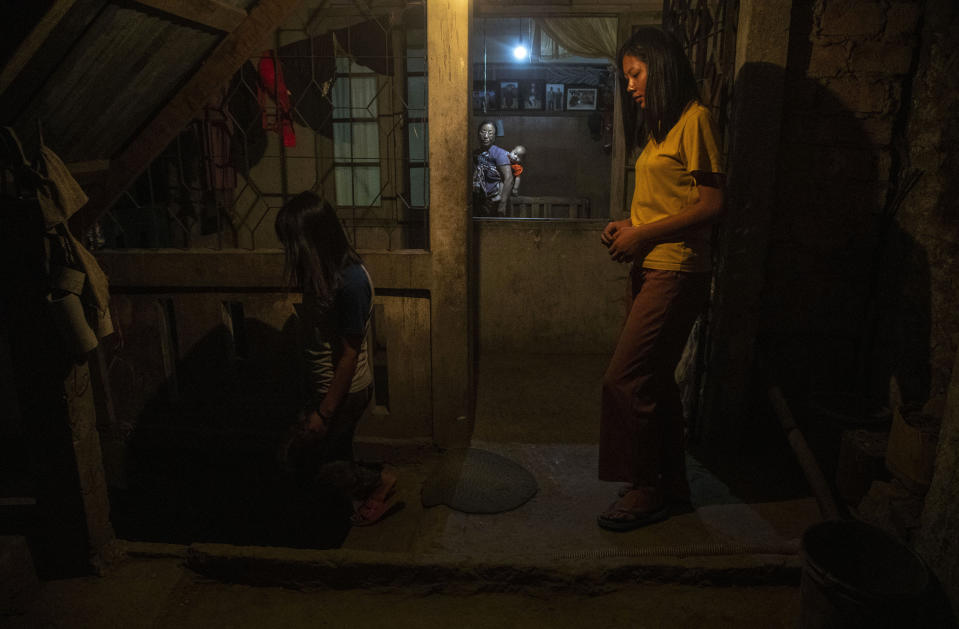 Police officers who fled Myanmar following a military coup rests at an undisclosed location bordering Myanmar, in the northeastern Indian state of Mizoram, Thursday, March 18, 2021. Villagers in Mizoram have given shelter to 34 Myanmar police personnel and 1 fire fighter, who crossed over to the state over the last two weeks. Those who escaped spend their time watching local television and doing daily chores. Some of them have carried mobile phones and are trying to connect to families they were forced to leave behind. At night, all of them go to sleep on mattresses laid on the floor of a single room. (AP Photo/Anupam Nath)