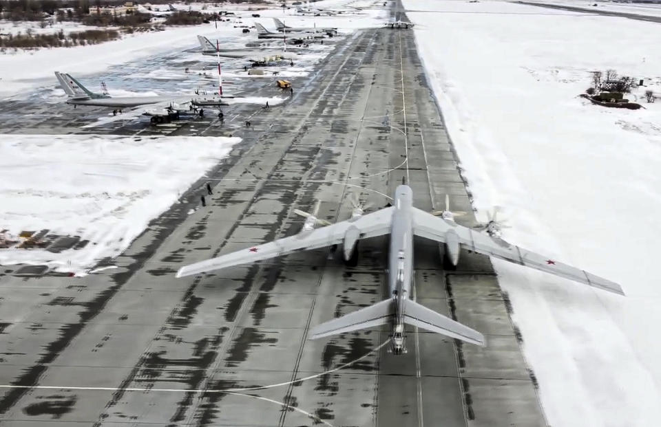 FILE - In this image from video provided by the Russian Defense Ministry Press Service, a Tu-95 strategic bomber from the Russian air force prepares to take off from an air base in Engels near the Volga River in Russia, Monday, Jan. 24, 2022. A buildup of an estimated 100,000 Russian troops near Ukraine has fueled Western fears of an invasion, but Moscow has denied having plans to launch an attack while demanding security guarantees from the the U.S. and its allies. (Russian Defense Ministry Press Service via AP, File)