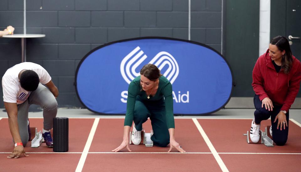 Britain's Catherine, Duchess of Cambridge, tries out the running track with starting blocks during a SportsAid event at the London Stadium in east London on February 26, 2020. (Photo by Yui Mok / POOL / AFP) (Photo by YUI MOK/POOL/AFP via Getty Images)