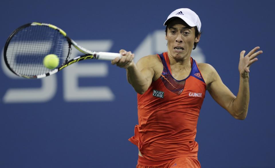 Francesca Schiavone, of Italy, returns to Serena Williams, of the United States, during the first round of the 2013 U.S. Open tennis tournament, Monday, Aug. 26, 2013, in New York. (AP Photo/Charles Krupa)