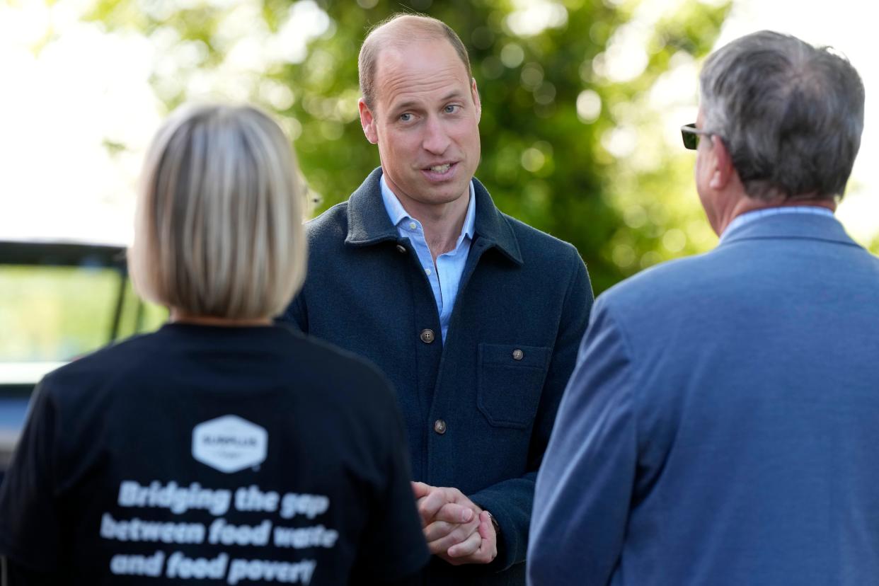 Prince William, Prince of Wales is greeted as he arrives for a visit to Surplus to Supper, in Sunbury-on-Thames on April 18, 2024, in Surrey, England.