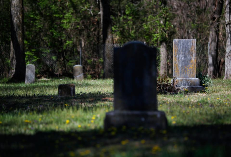 Headstones at the McElhaney Cemetery located off the South Creek Greenway in southwest Springfield on Tuesday, April 11, 2023.