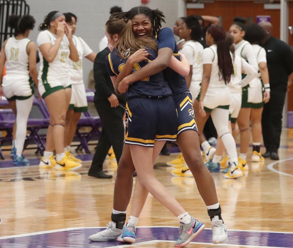 Streetsboro's Ella Kassan and Naomi Benson celebrate their victory over St. Vincent-St. Mary in a regional seminal at Barberton High School, Tuesday, March 5, 2024.