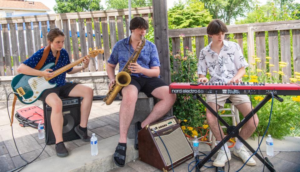 The Longstreet Combo, consisting of Sofie Markle (left), Liam Avelluto and Jordan Steinbrook, plays jazz while COPA members work on their projects June 25.