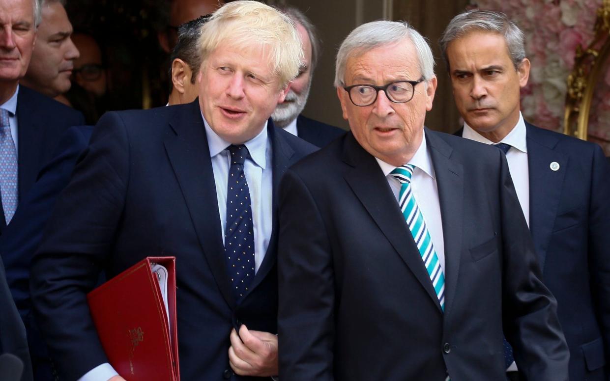 Boris Johnson and Jean-Claude Juncker leave their meeting in Luxembourg earlier this week - REX