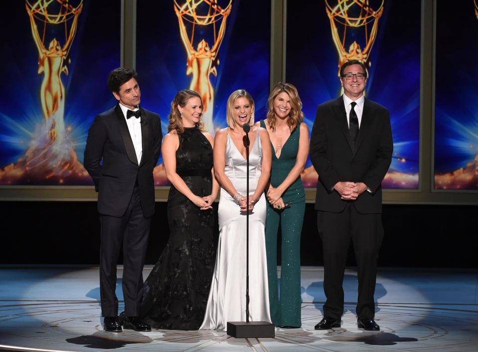 Lori Loughlin appears with "Fuller House" actors John Stamos, far left, Andrea Barber, Candace Cameron Bure and Bob Saget during night one of the Creative Arts Emmy Awards on Sept. 8, 2018, in Los Angeles.
