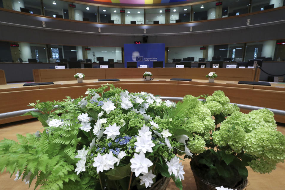 A meeting room especially adapted to adhere to physical distance guidelines for EU leaders for an upcoming EU summit at the European Council building in Brussels, Thursday, July 16, 2020. On Friday, July 17, 2020, leaders from the 27 European Union nations will meet face-to-face to try to carve up a potential package of 1.85 trillion euros among themselves. Due to coronavirus concerns, Friday's summit will be held in a larger-than-usual meeting room to meet social distancing requirements, the media will be kept to a minimum and there will be no group photo of the leaders. (Yves Herman, Pool Photo via AP)