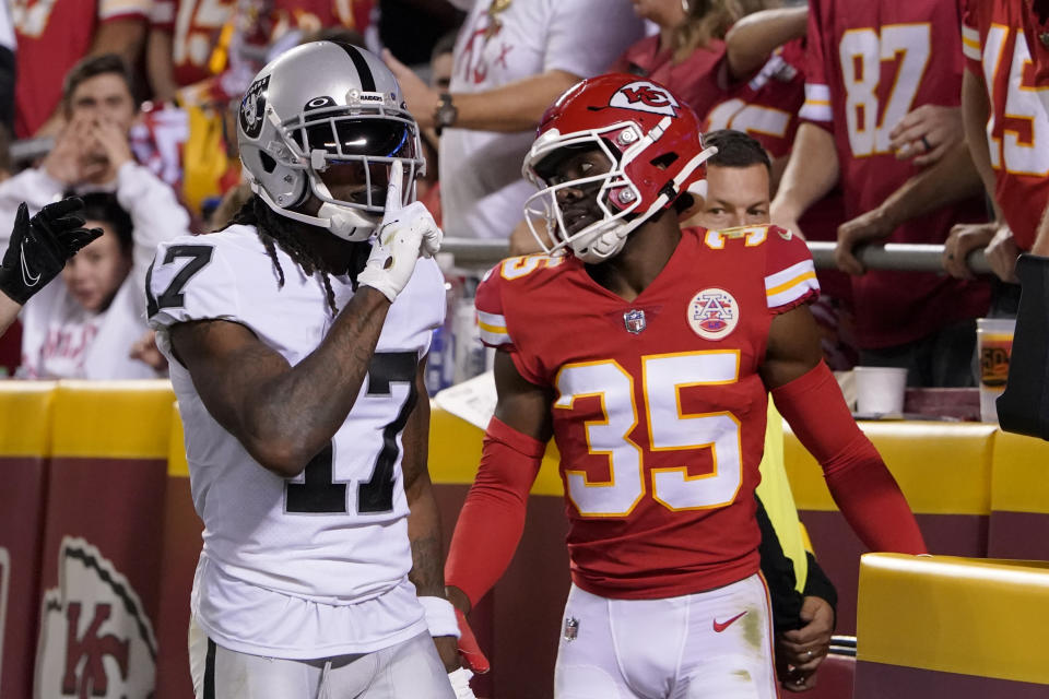 Las Vegas Raiders wide receiver Davante Adams (17) celebrates after scoring as Kansas City Chiefs cornerback Jaylen Watson (35) watches during the second half of an NFL football game Monday, Oct. 10, 2022, in Kansas City, Mo. (AP Photo/Ed Zurga)