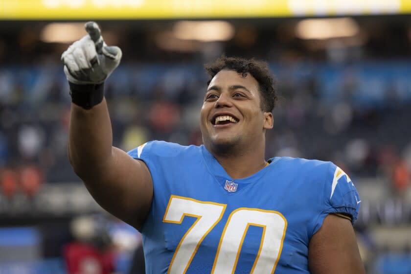 Los Angeles Chargers offensive tackle Rashawn Slater (70) walks.