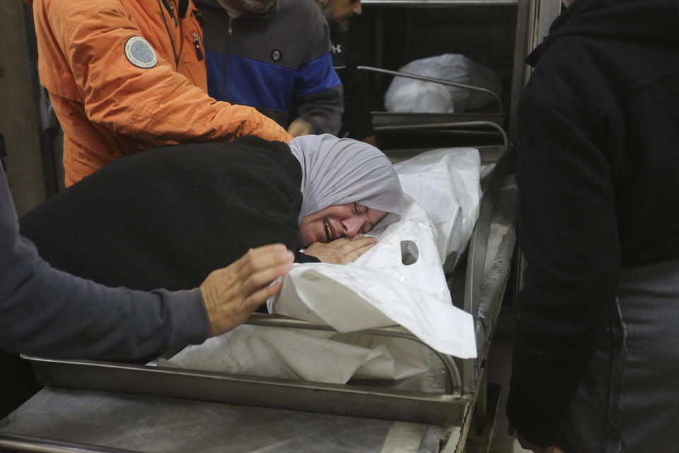 Palestinians mourn the members of the Abu Shalama family killed in an Israeli strike in Rafah, Gaza Strip, on Wednesday, Nov. 22, 2023. (AP Photo/Hatem Ali)