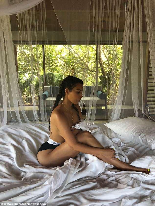 Kim Kardashian poses topless to promote spa treatments