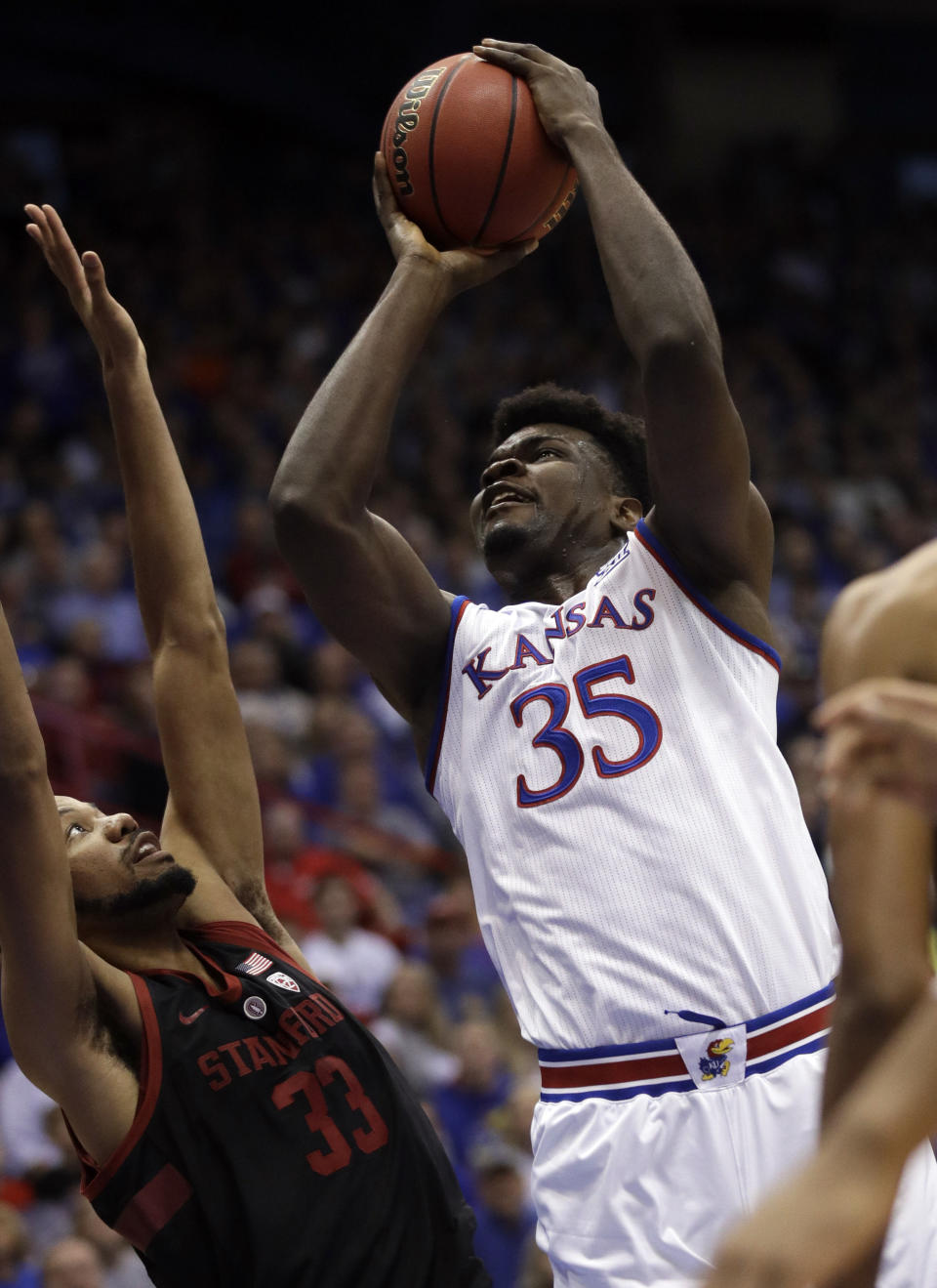 Kansas center Udoka Azubuike (35) shoots over Stanford forward Trevor Stanback (33) during the first half of an NCAA college basketball game in Lawrence, Kan., Saturday, Dec. 1, 2018. (AP Photo/Orlin Wagner)
