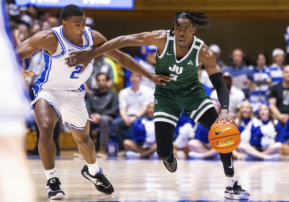 Jacksonville's Kevion Nolan (3) handles the ball as Duke's Jaylen Blakes (2) defends during the first half of an NCAA college basketball game in Durham, N.C., Monday, Nov. 7, 2022. (AP Photo/Ben McKeown)