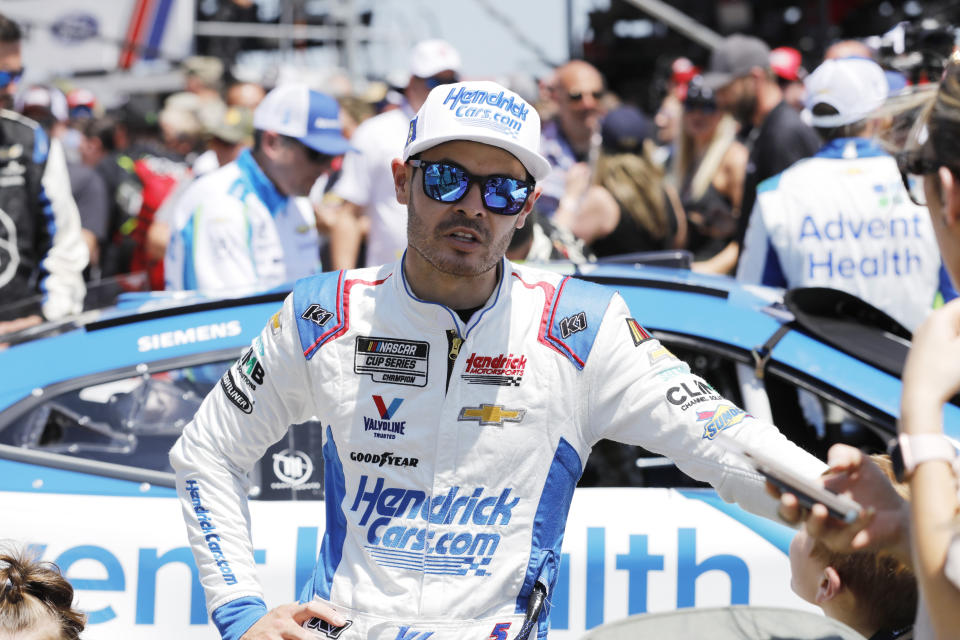 Kyle Larson stands on pit road as he waits for a NASCAR Cup Series auto race at Kansas Speedway in Kansas City, Kan., Sunday, May 7, 2023. (AP Photo/Colin E. Braley)