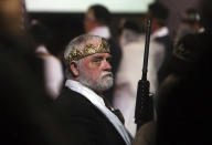 <p>A man wears a crown and holds an unloaded weapon at the World Peace and Unification Sanctuary, Wednesday, Feb. 28, 2018, in Newfoundland, Pa. (Photo: Jacqueline Larma/AP) </p>