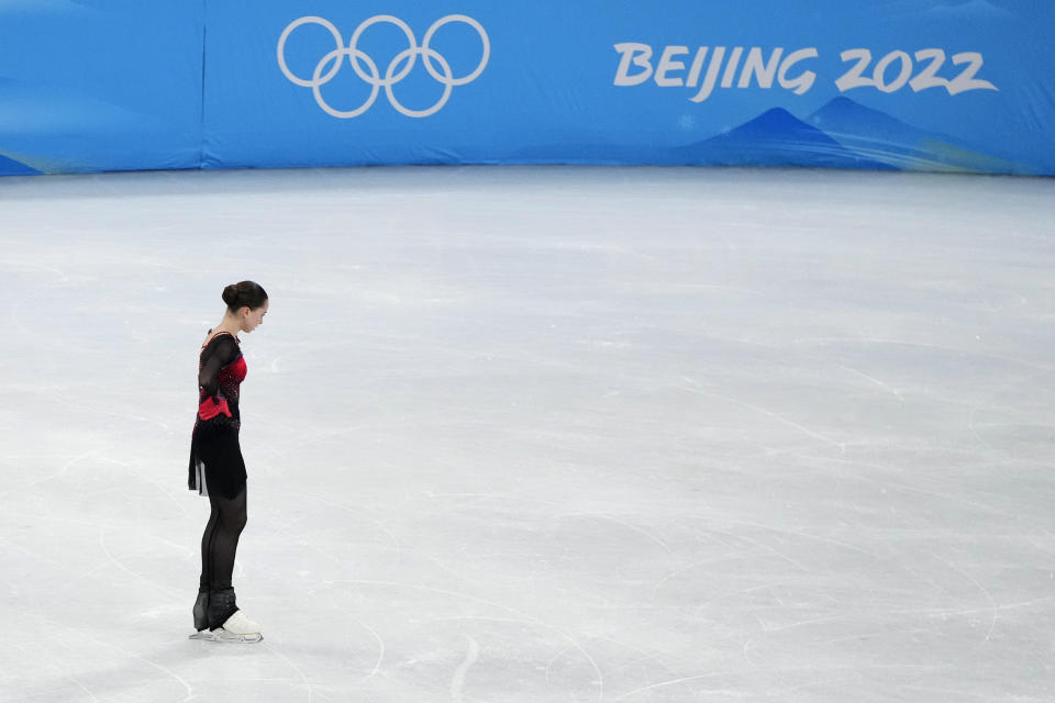 Kamila Valieva, of the Russian Olympic Committee, reacts after the women's free skate program during the figure skating competition at the 2022 Winter Olympics, Thursday, Feb. 17, 2022, in Beijing. (AP Photo/Natacha Pisarenko)