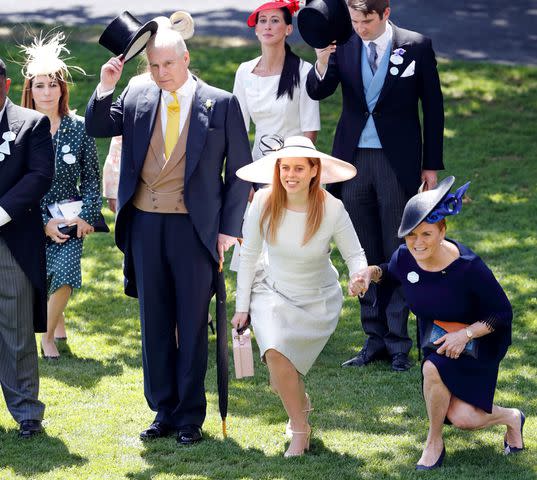 <p>Max Mumby/Indigo/Getty</p> Prince Andrew, Princess Beatrice and Sarah Ferguson, Duchess of York, attend the Royal Ascot in 2018.
