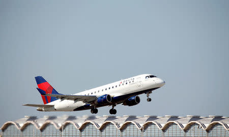 FILE PHOTO: A Delta Airlines jet takes off from Washington National Airport in Washington, U.S., August 9, 2017. REUTERS/Joshua Roberts/File Photo