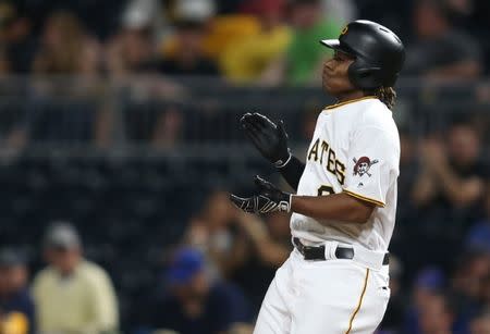 Apr 26, 2017; Pittsburgh, PA, USA; Pittsburgh Pirates second baseman Gift Ngoepe (61) reacts after recording his first major league hit against the Chicago Cubs during the fourth inning at PNC Park. Mandatory Credit: Charles LeClaire-USA TODAY Sports