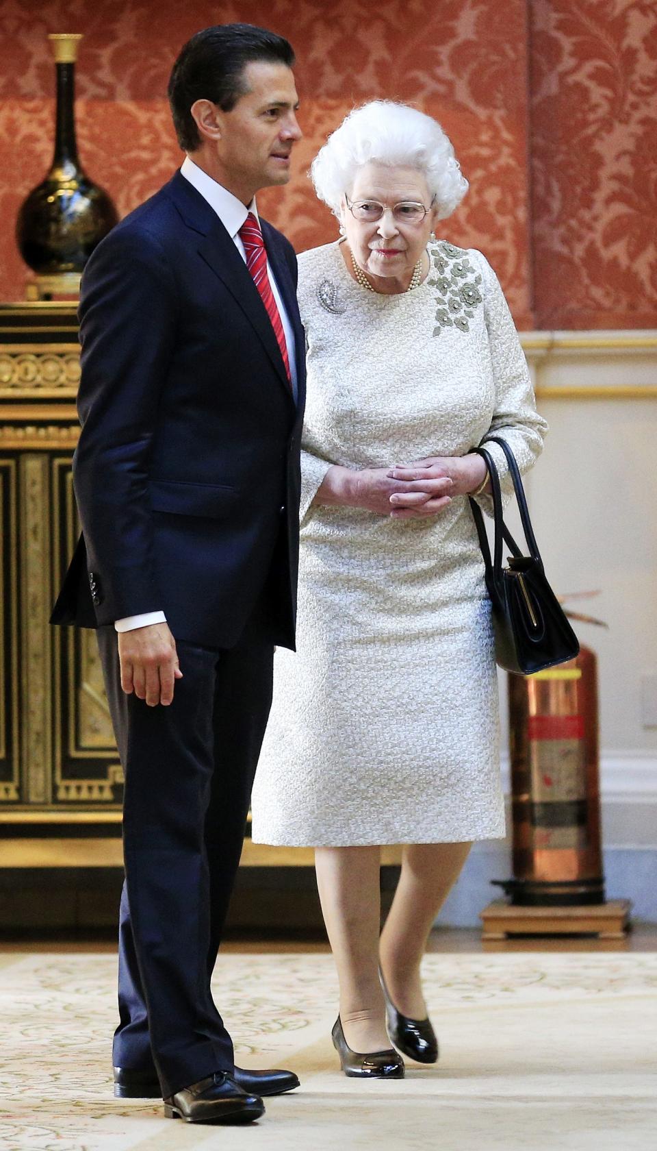 The President of Mexico Enrique Pena Nieto is shown into the Picture Gallery to view Mexican items in the Royal Collection by Britain's Queen Elizabeth at Buckingham Palace, London