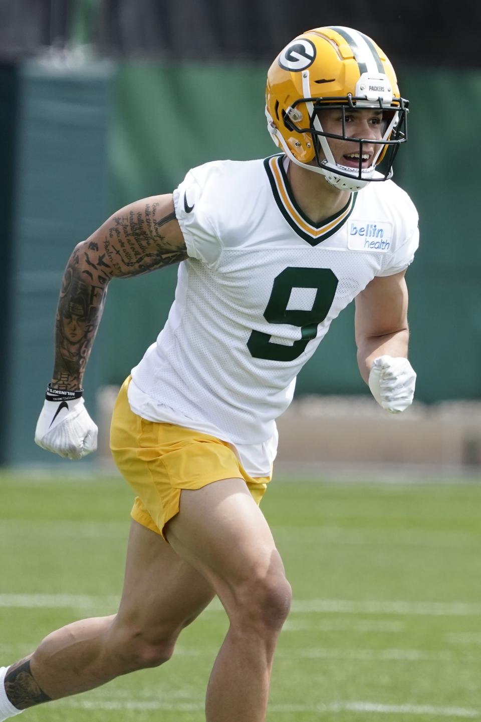 Green Bay Packers' Christian Watson runs a drill at the NFL football team's practice field training camp Tuesday, May 24, 2022, in Green Bay, Wis. (AP Photo/Morry Gash)