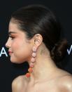 <p>Behind her right ear, Gomez has the initial 'G' tatttooed, which according to <a href="https://pagesix.com/list/selena-gomezs-tattoos-complete-guide-to-all-of-their-meanings/" rel="nofollow noopener" target="_blank" data-ylk="slk:Page Six;elm:context_link;itc:0;sec:content-canvas" class="link ">Page Six</a> is in honour of her little sister Gracie. </p>