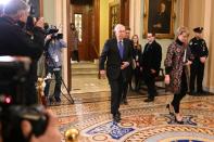 Senate Majority Leader McConnell exits the Senate chamber after the third day of the Senate impeachment trial of President Trump