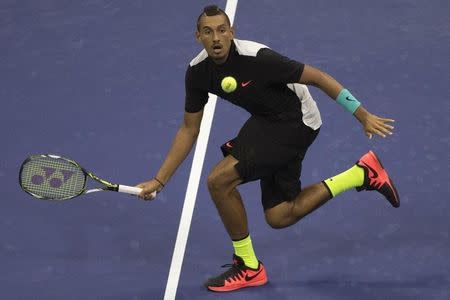 Nick Kyrgios of Australia hits a return to Andy Murray of Britain during their first round match at the U.S. Open Championships tennis tournament in New York, August 31, 2015. REUTERS/Adrees Latif