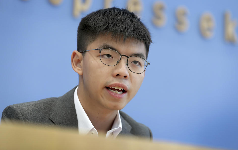 FILE - In this Sept. 11, 2019, file photo, Hong Kong activist Joshua Wong addresses the media during a press conference in Berlin, Germany. Overseas, Joshua Wong has emerged as a prominent face of Hong Kong's months-long protests for full democracy. At home, he is just another protester. (AP Photo/Michael Sohn, File)