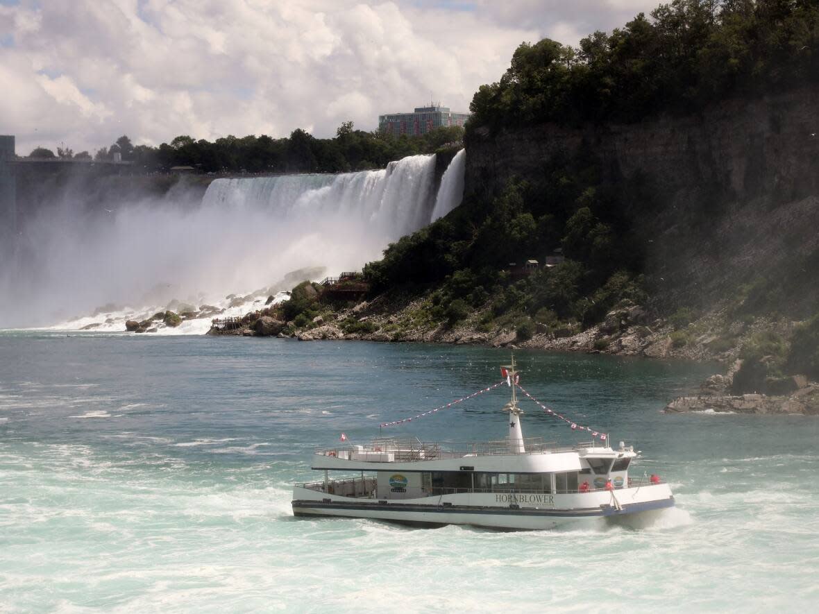An almost empty Hornblower tour boat operated from the Canadian side of the Niagara River is seen in Niagara Falls, Ont., on Tuesday, July 14, 2020.  Anti-COVID measures, particularly the closure of the U.S. border, had prompted a steep decline of visitors to one of the world's top tourist destination. (Colin Perkel/THE CANADIAN PRESS - image credit)