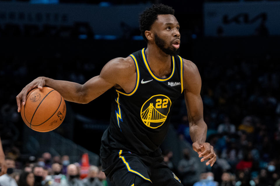 CHARLOTTE, NORTH CAROLINA - NOVEMBER 14: Andrew Wiggins #22 of the Golden State Warriors brings the ball up court against the Charlotte Hornets during their game at Spectrum Center on November 14, 2021 in Charlotte, North Carolina. NOTE TO USER: User expressly acknowledges and agrees that, by downloading and or using this photograph, User is consenting to the terms and conditions of the Getty Images License Agreement. (Photo by Jacob Kupferman/Getty Images)