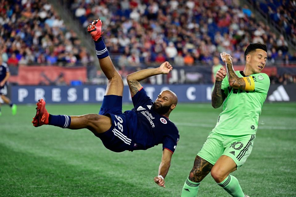 Austin FC attacker Sebastián Driussi, right, protects himself from a bicycle kick from New England Revolution defender Andrew Farrell during their match on Sept. 2 at Gillette Stadium in Foxborough, Mass. El Tree hosts the Portland Timbers on Sunday.