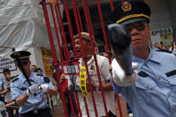 Protesters dressed as China police during a protest to demand authorities scrap a proposed extradition bill with China, in Hong Kong, China April 28, 2019. REUTERS/Tyrone Siu