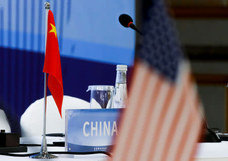 The Chinese and U.S. national flags are seen before the start of a Treaty on the Non-Proliferation of Nuclear Weapons (NPT) conference with the UN Security Council's five permanent members (P5) China, France, Russia, Britain, and U.S., in Beijing, China, January 30, 2019. REUTERS/Thomas Peter/Pool/Files