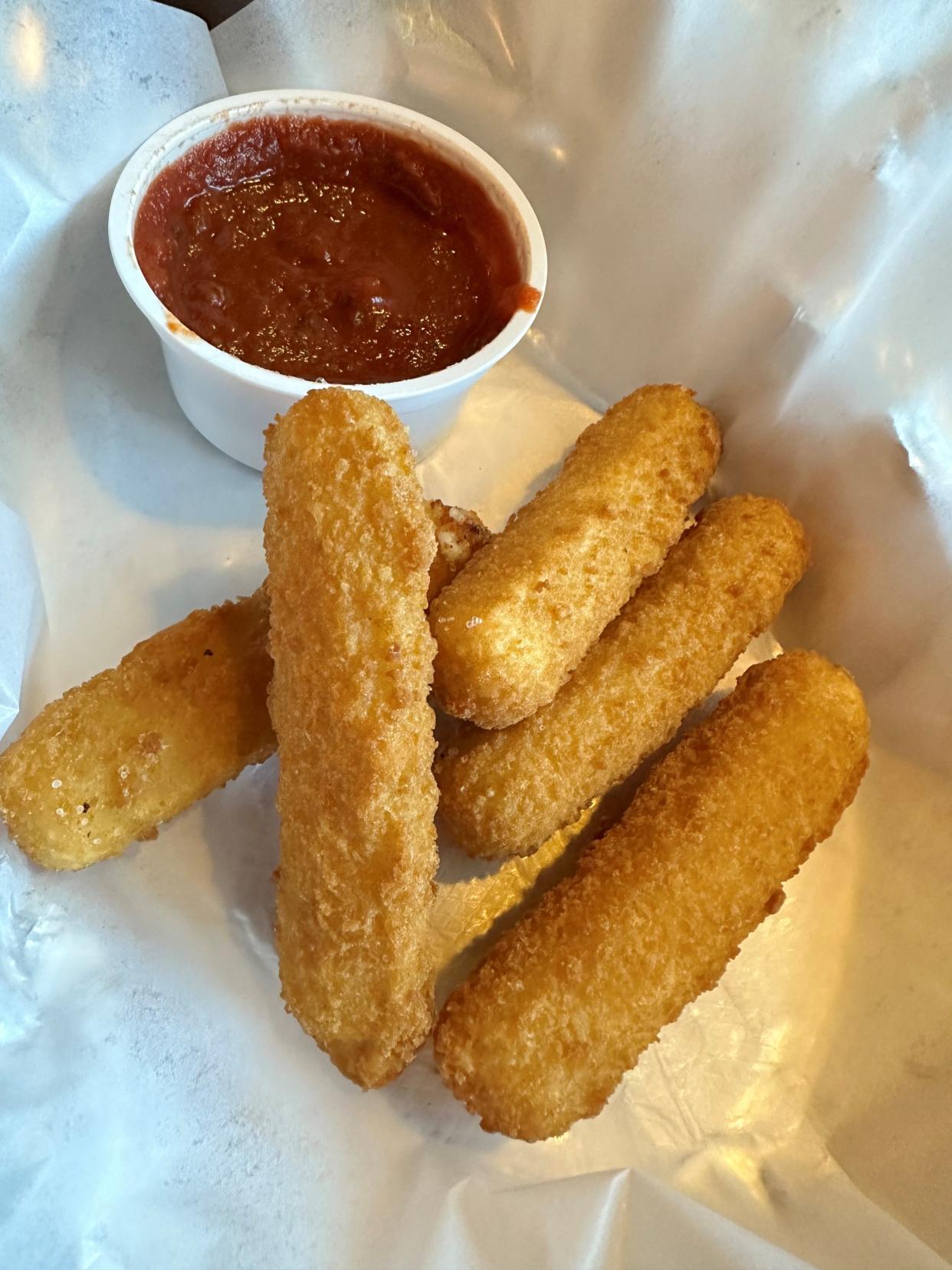 Hot, crispy and melty, these fried mozzarella sticks with marinara sauce make for a welcome appetizer.