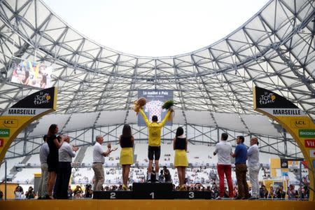 Cycling - The 104th Tour de France cycling race - The 22.5-km individual time trial Stage 20 from Marseille to Marseille, France - July 22, 2017 - Team Sky rider Chris Froome of Britain celebrates on the podium, wearing the overall leader's yellow jersey. REUTERS/Christian Hartmann