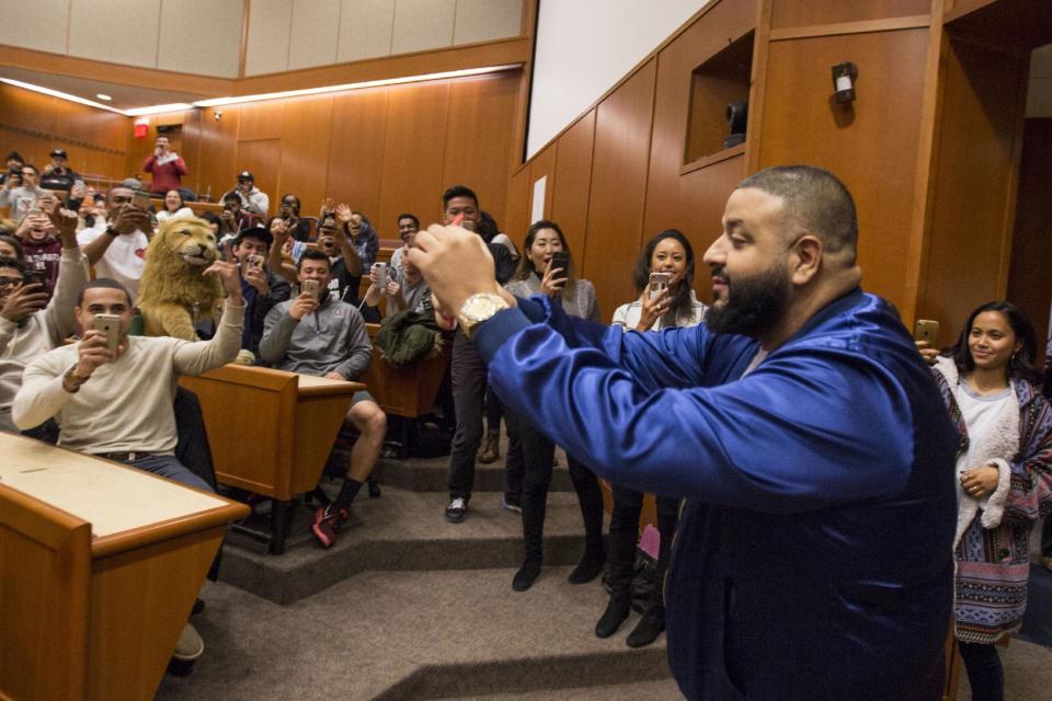 DJ Khaled posts a snap chat as he enters Harvard Business School during the Get Schooled Snapchat College Tour and Meet at Harvard University on December 9, 2016 in Cambridge, Massachusetts. (Photo by Scott Eisen/Getty Images for Get Schooled Foundation)