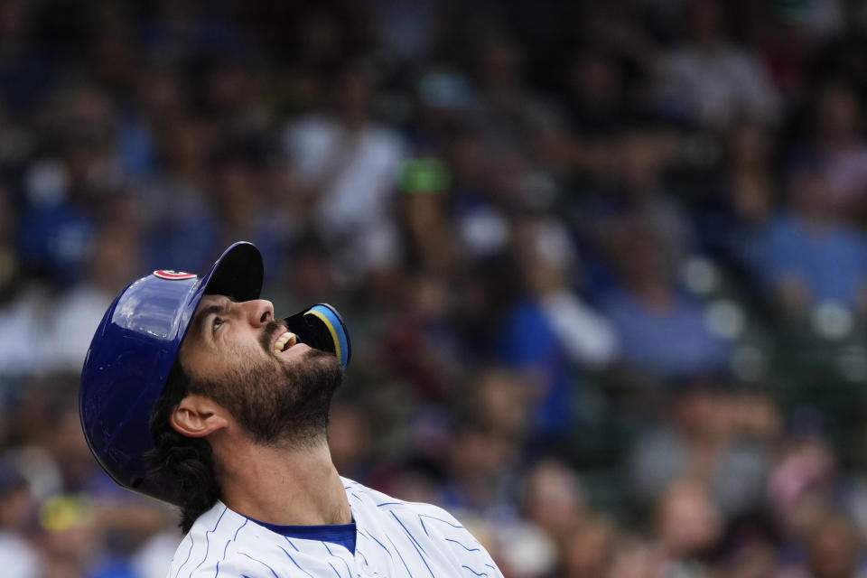 Chicago Cubs' Dansby Swanson reacts as he pops out to Colorado Rockies second baseman Brendan Rodgers during the first inning of a baseball game in Chicago, Friday, Sept. 22, 2023. (AP Photo/Nam Y. Huh)