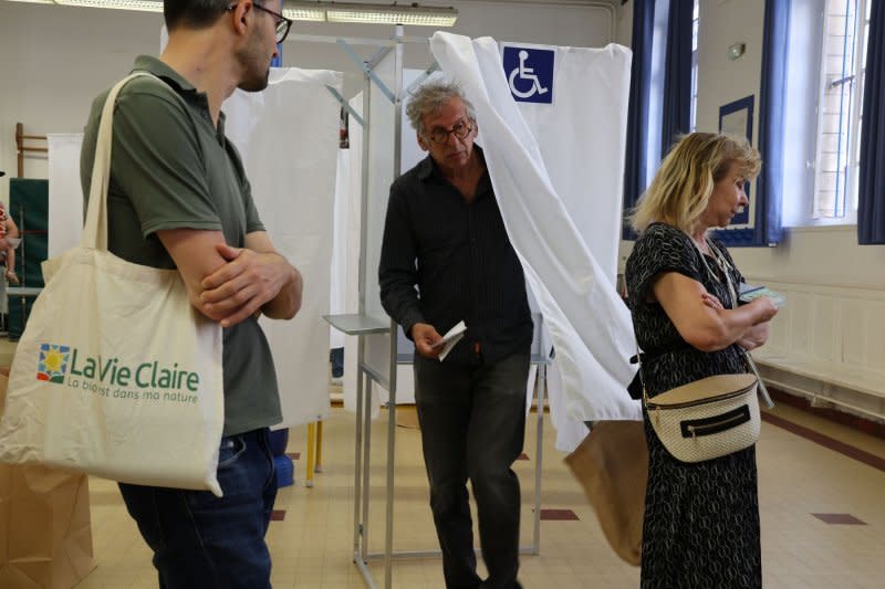 Voters line up to cast their ballot during the first-round of parliamentary elections in Paris, France, on Sunday. The divided country is voting in high-stakes snap elections that could see Marine Le Pen's far-right National Rally sweep to power in a historic first. Photo by Maya Vidon-White/UPI