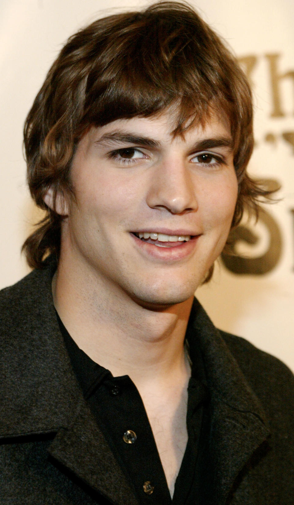 Ashton Kutcher arrives at an event celebrating the 100th episode of "That ''70's Show" on April 10, 2002