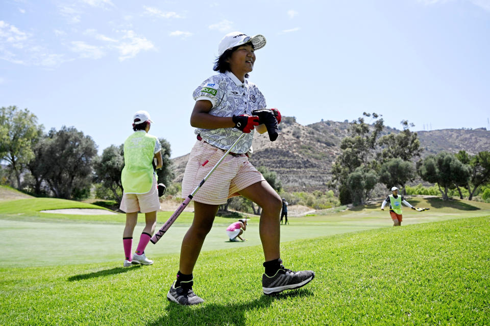 Miroku Suto walks off the green after hitting a birdie putt on the ninth hole during the final round of the Junior World Championships golf tournament at Singing Hills Golf Resort on Thursday, July 14, 2022, in El Cajon, Calif. (AP Photo/Denis Poroy)