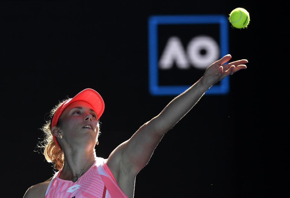 Belgium's Elise Mertens serves to Switzerland's Belinda Bencic during their third round match at the Australian Open tennis championship in Melbourne, Australia, Saturday, Feb. 13, 2021.(AP Photo/Andy Brownbill)