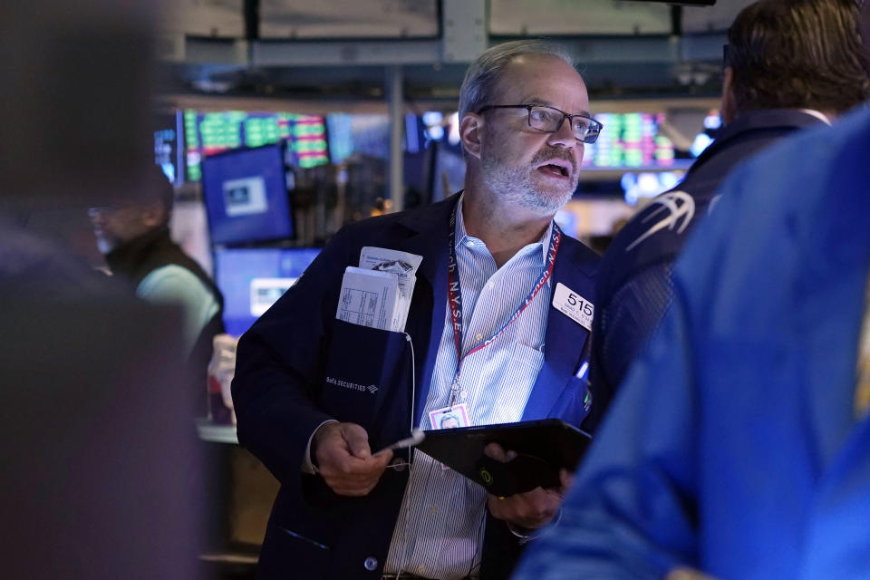 Trader Davis O'Day works on the floor of the New York Stock Exchange, Friday, July 23, 2021. Stocks rose in early trading on Wall Street Friday and put the major indexes on track for a strong finish in a week that opened with a stumble. (AP Photo/Richard Drew)